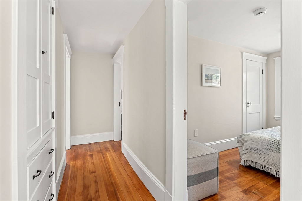 15 Middle Road Amesbury, MA 01913 - Photo 16 of 16 a bedroom with a bed and wooden floor