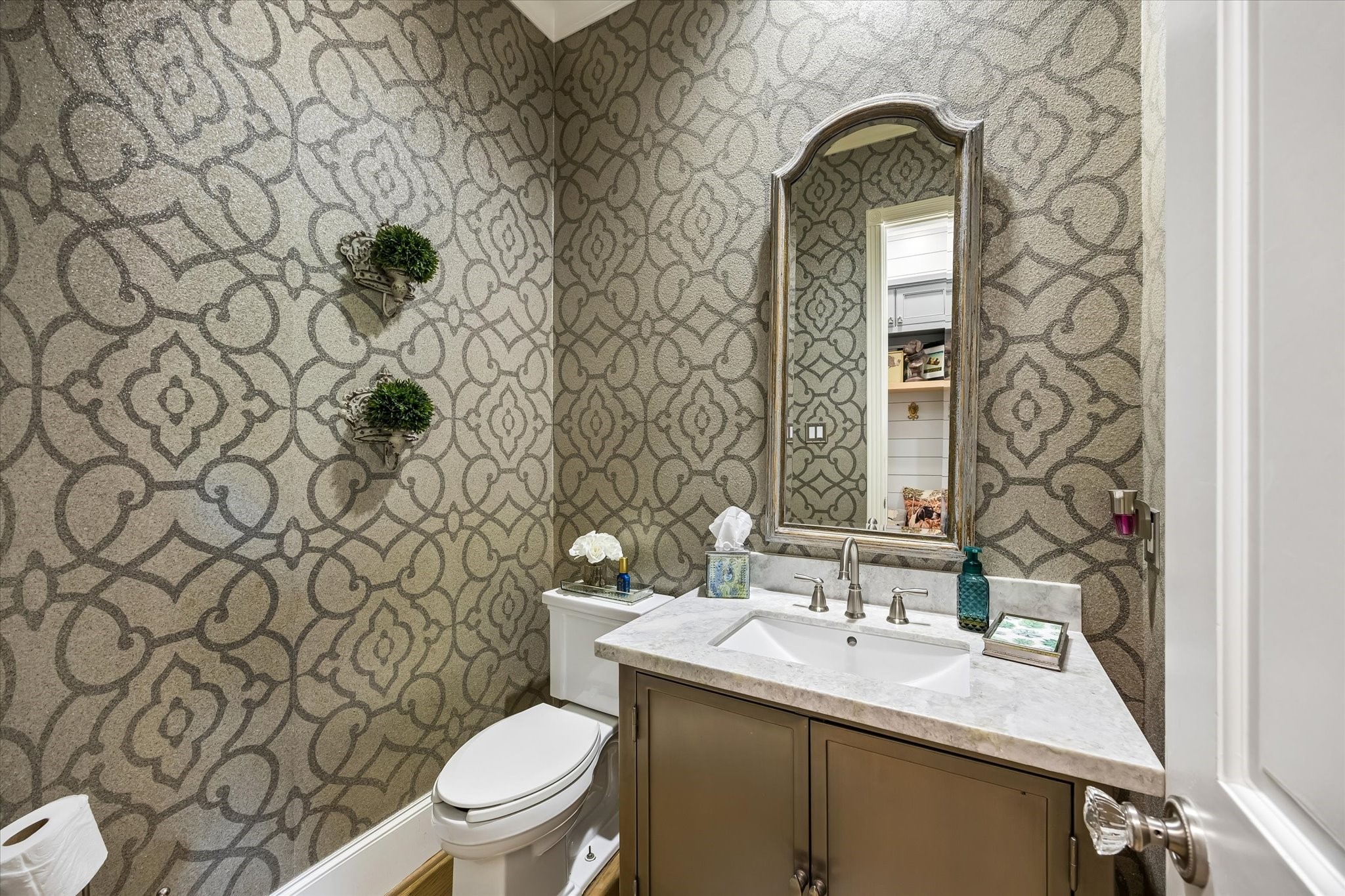 597 Piney Point Road Piney Point Village, TX 77024 - Photo 12 of 39 One of 2 powder rooms on first floor. This lovely powder room is located off the kitchen.