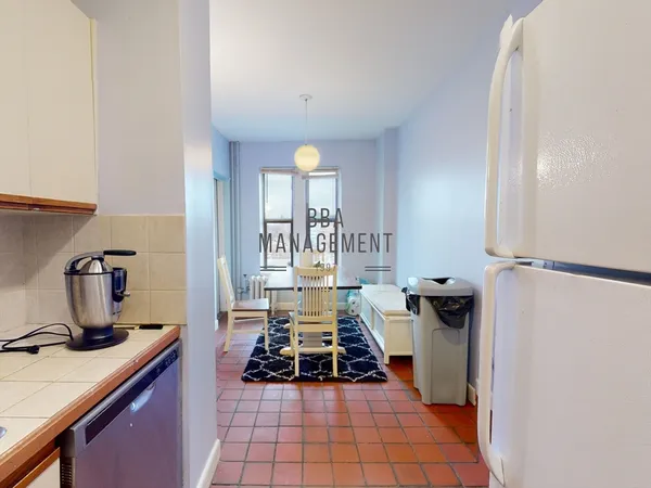 a kitchen with a sink and a stove top oven