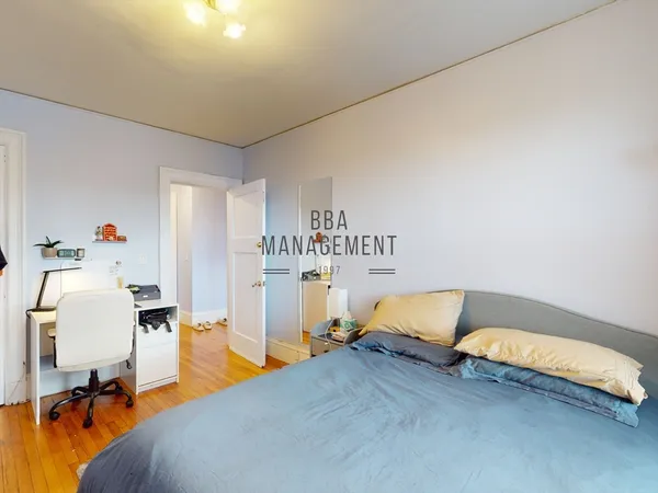 a bedroom with a bed and gym equipment