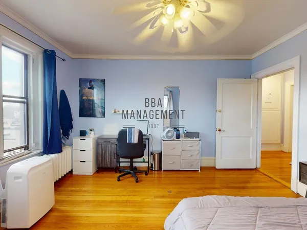 a view of a livingroom with workspace and a window