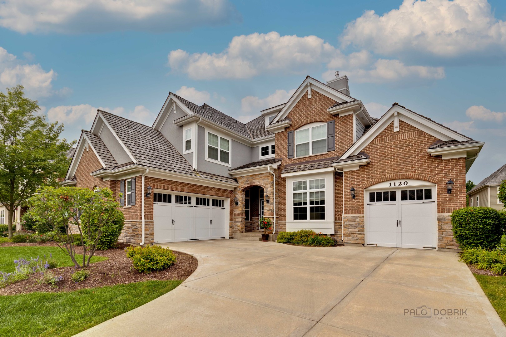 front view of a house with a yard