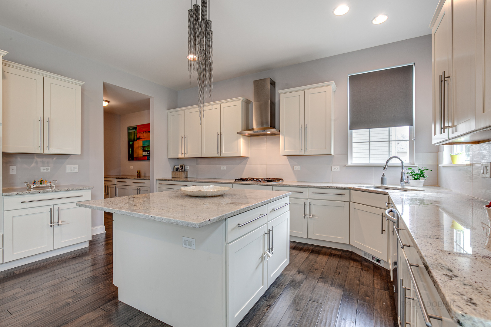 1120 Ashley Lane Inverness, IL 60010 - Photo 13 of 46 a kitchen with a sink stove cabinets and wooden floor