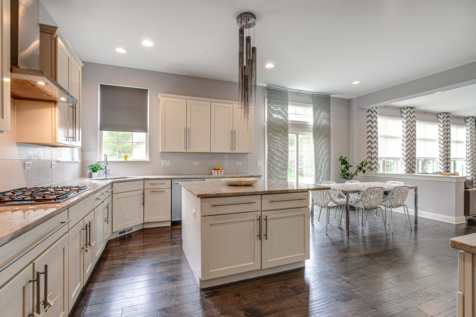 1120 Ashley Lane Inverness, IL 60010 - Photo 14 of 46 a kitchen with a table chairs stove and cabinets