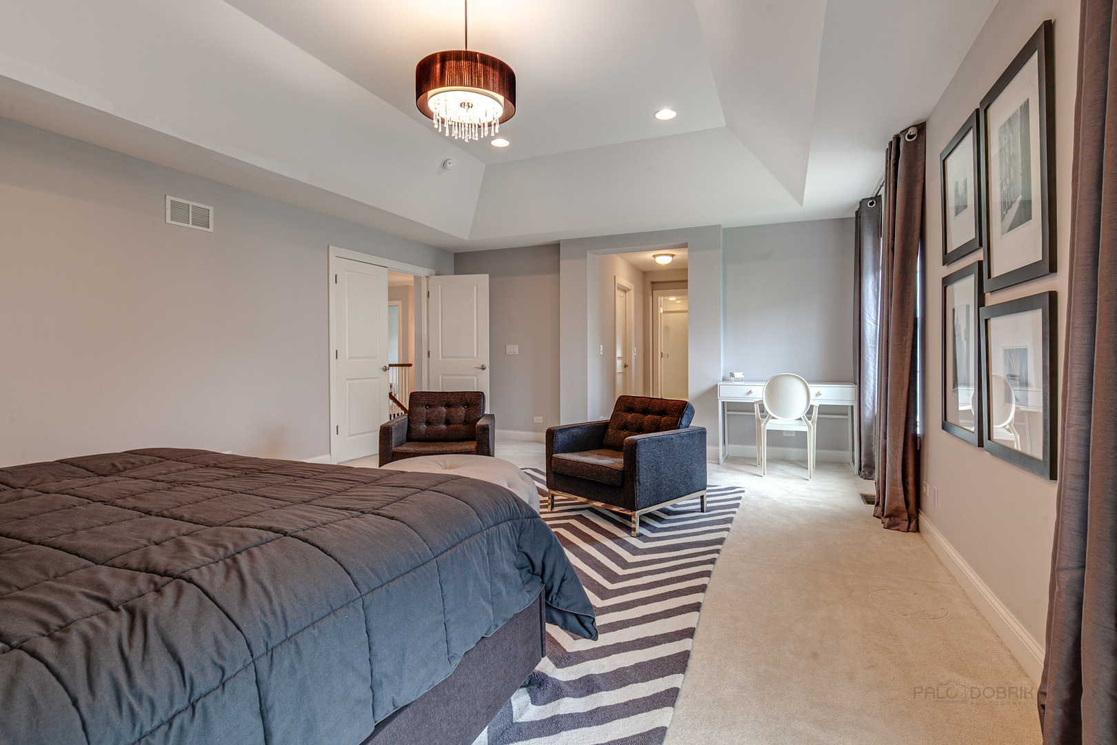 1120 Ashley Lane Inverness, IL 60010 - Photo 22 of 46 a spacious bedroom with a bed couch and a large window