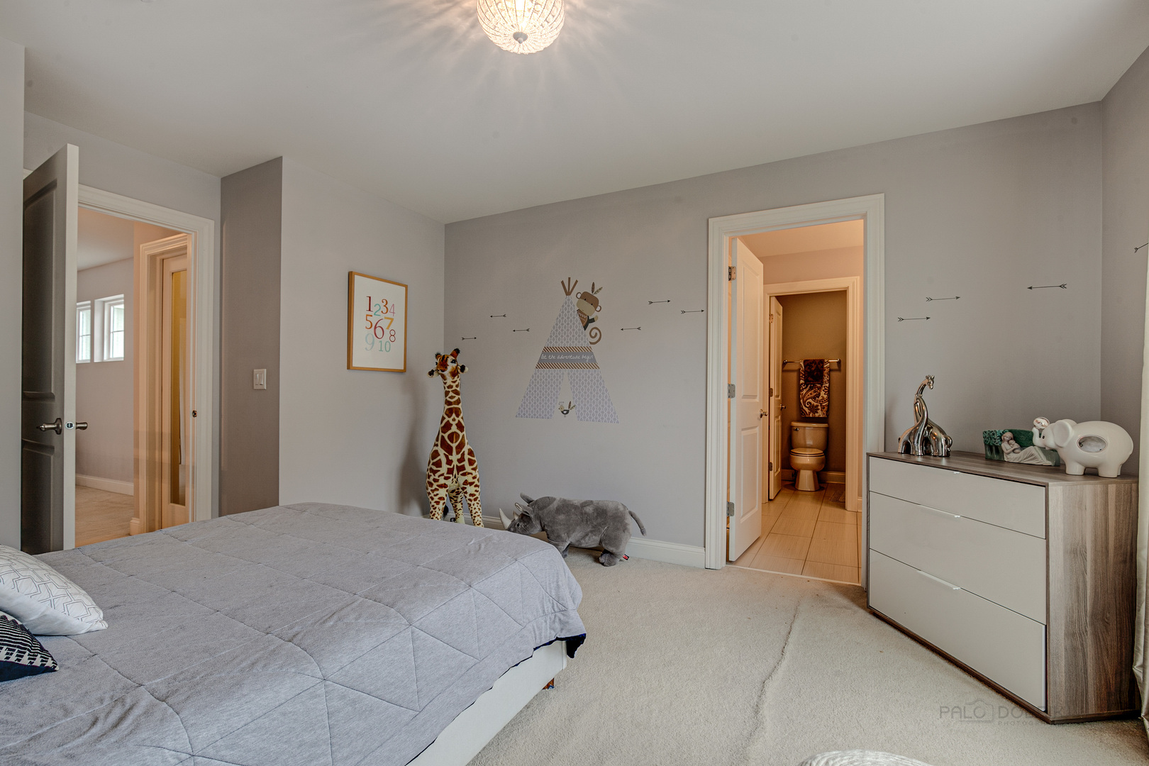 1120 Ashley Lane Inverness, IL 60010 - Photo 30 of 46 a bedroom with a bed and a chandelier