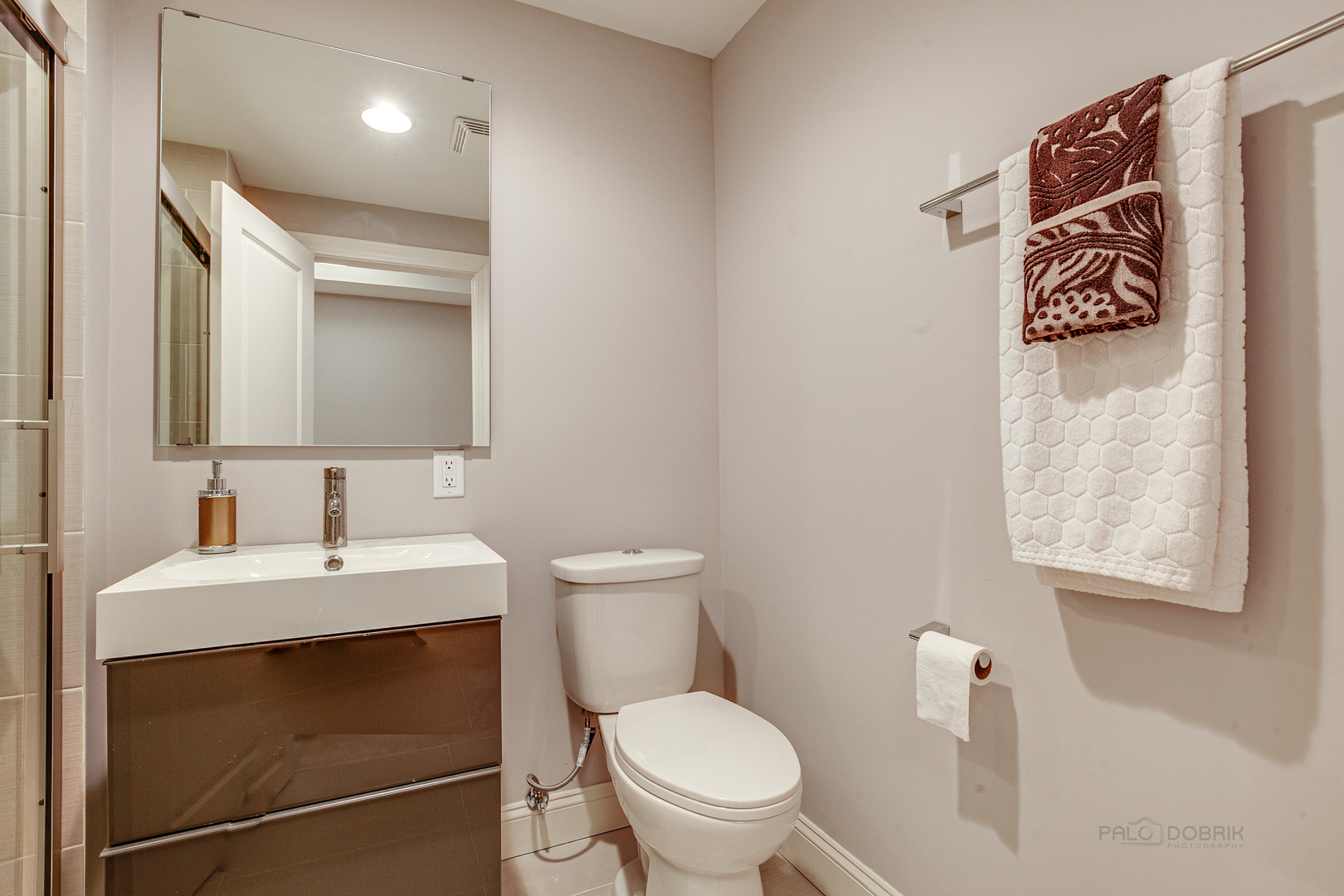 1120 Ashley Lane Inverness, IL 60010 - Photo 38 of 46 a bathroom with a toilet sink and mirror