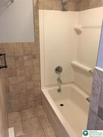 a living room with lots of furniture and gym equipment