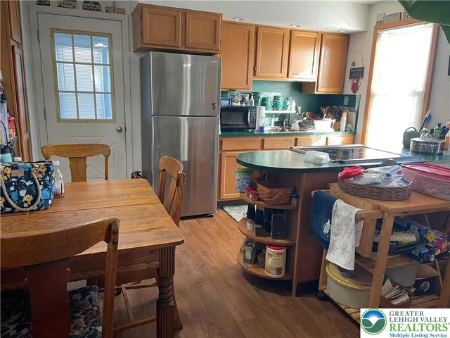 a living room with furniture and a mirror