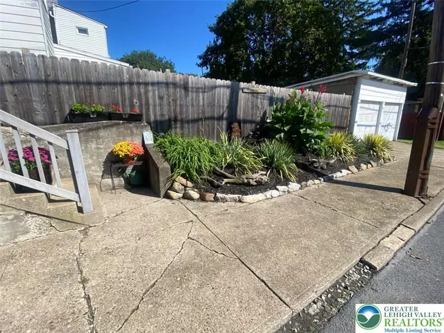 a view of a kitchen with wooden floor and a chandelier