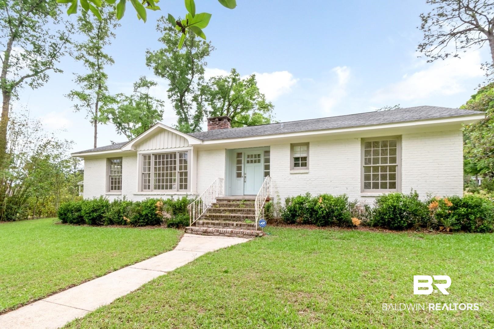 4 Turnout Lane Mobile, AL 36608 - Photo 1 of 53 Single story home with brick siding, a front lawn, and a chimney