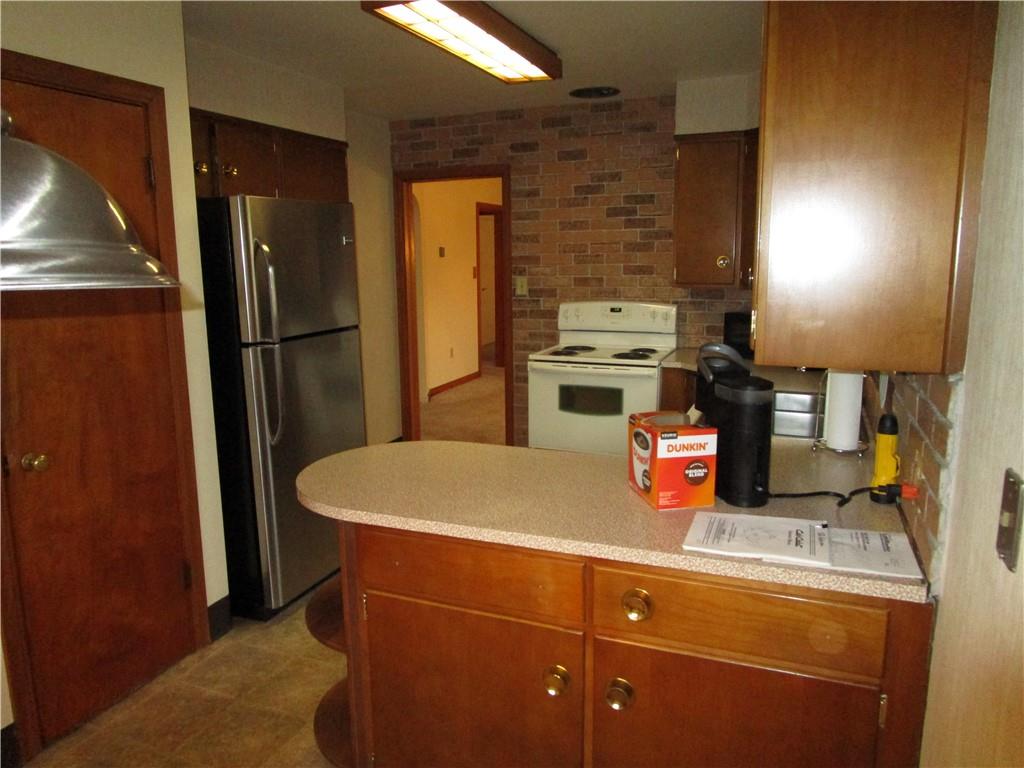 410 Hazen Road Sharpsville, PA 16150 - Photo 12 of 22 a kitchen with stainless steel appliances granite countertop a refrigerator and a stove
