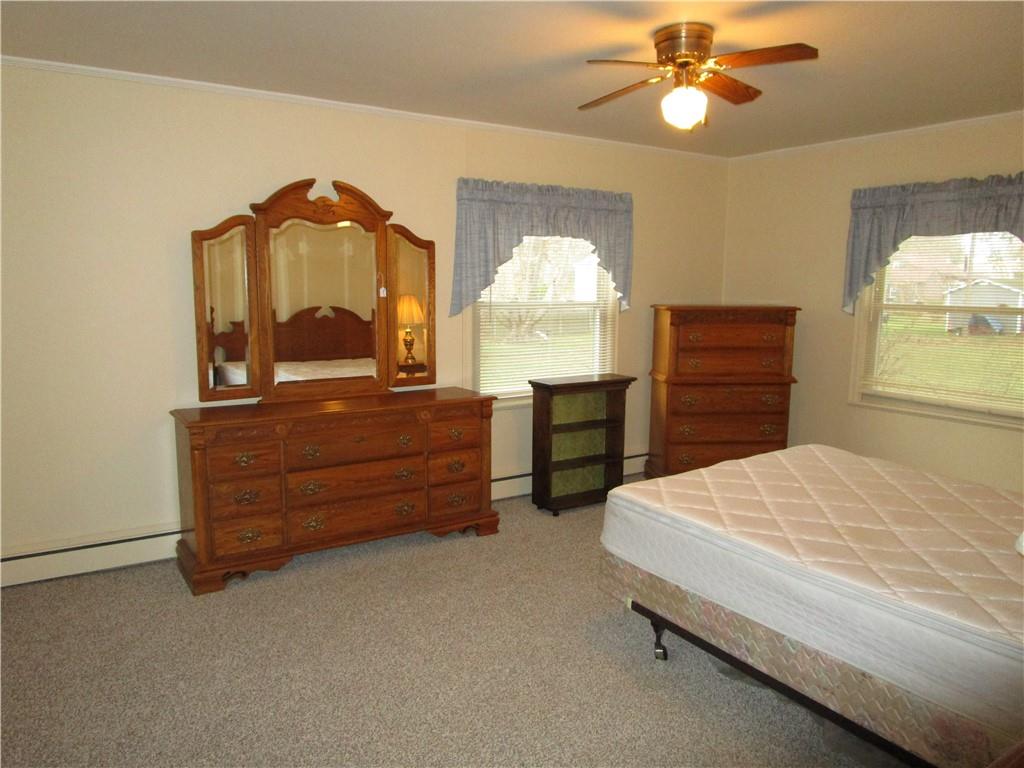 410 Hazen Road Sharpsville, PA 16150 - Photo 14 of 22 a bedroom with a bed and a dresser