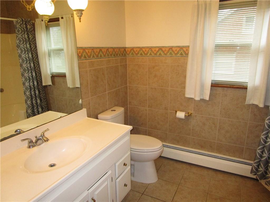 410 Hazen Road Sharpsville, PA 16150 - Photo 17 of 22 a bathroom with a sink a toilet and shower