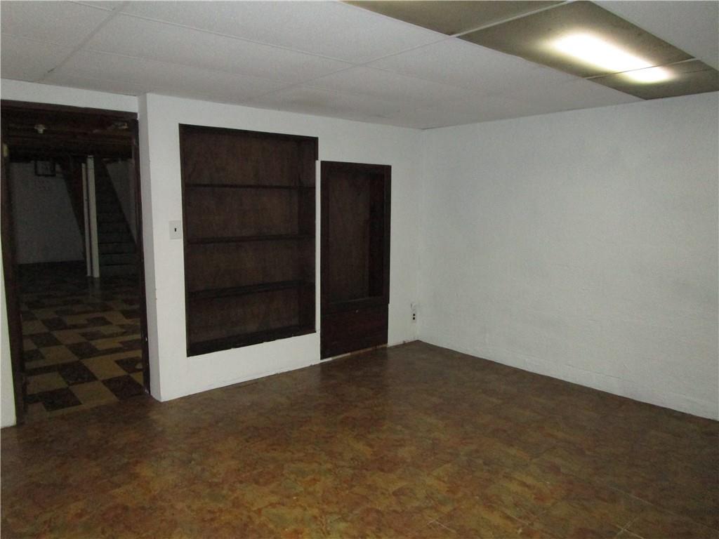 410 Hazen Road Sharpsville, PA 16150 - Photo 18 of 22 a view of an empty room with a cabinet and a window