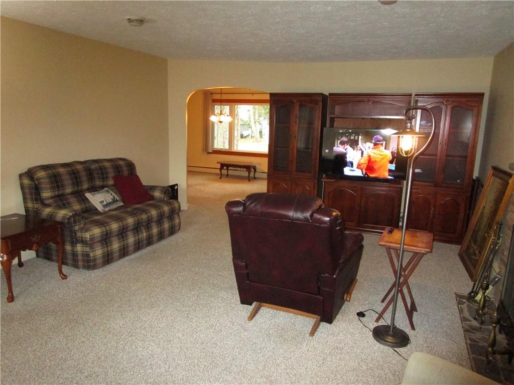 410 Hazen Road Sharpsville, PA 16150 - Photo 6 of 22 a living room with furniture and a flat screen tv