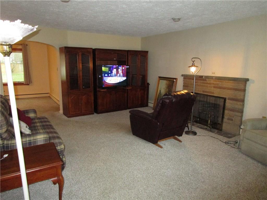 410 Hazen Road Sharpsville, PA 16150 - Photo 8 of 22 a living room with furniture and a flat screen tv