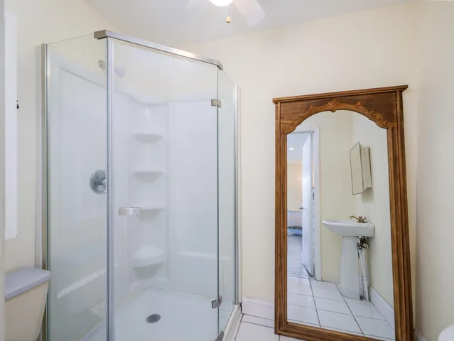 a view of a bathroom with a glass door shower
