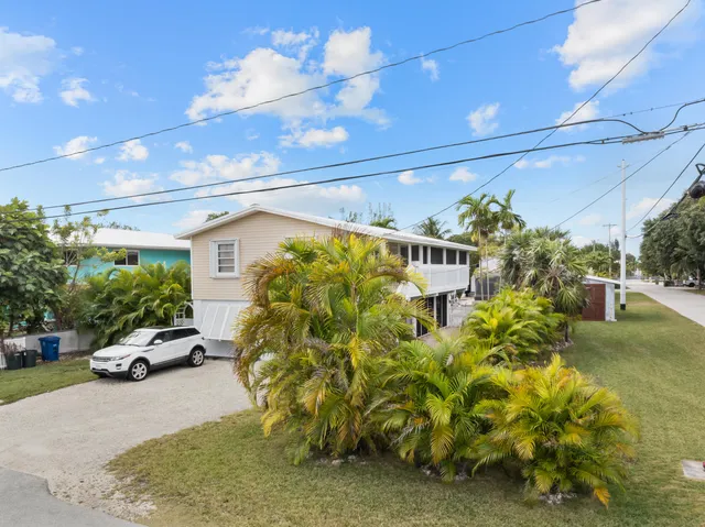 an aerial view of a house with a garden