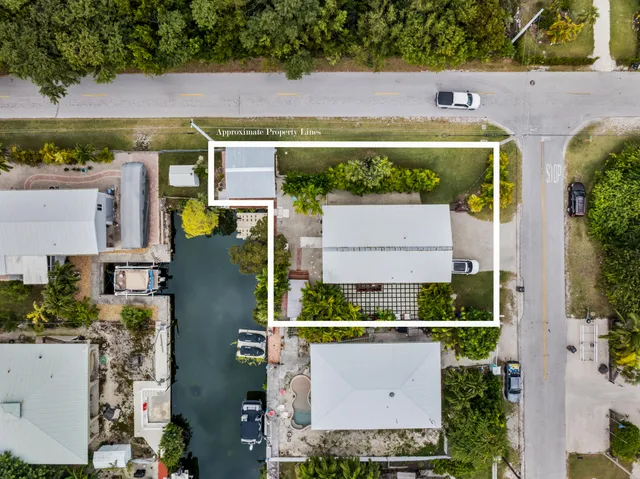 an aerial view of residential house with outdoor space