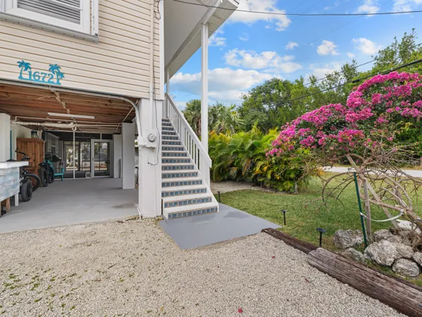 a large kitchen with stainless steel appliances granite countertop a stove and a sink