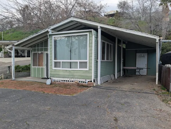 a front view of a house with a garage