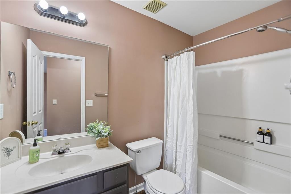 9720 Poole Road Villa Rica, GA 30180 - Photo 14 of 40 a bathroom with a sink toilet and shower