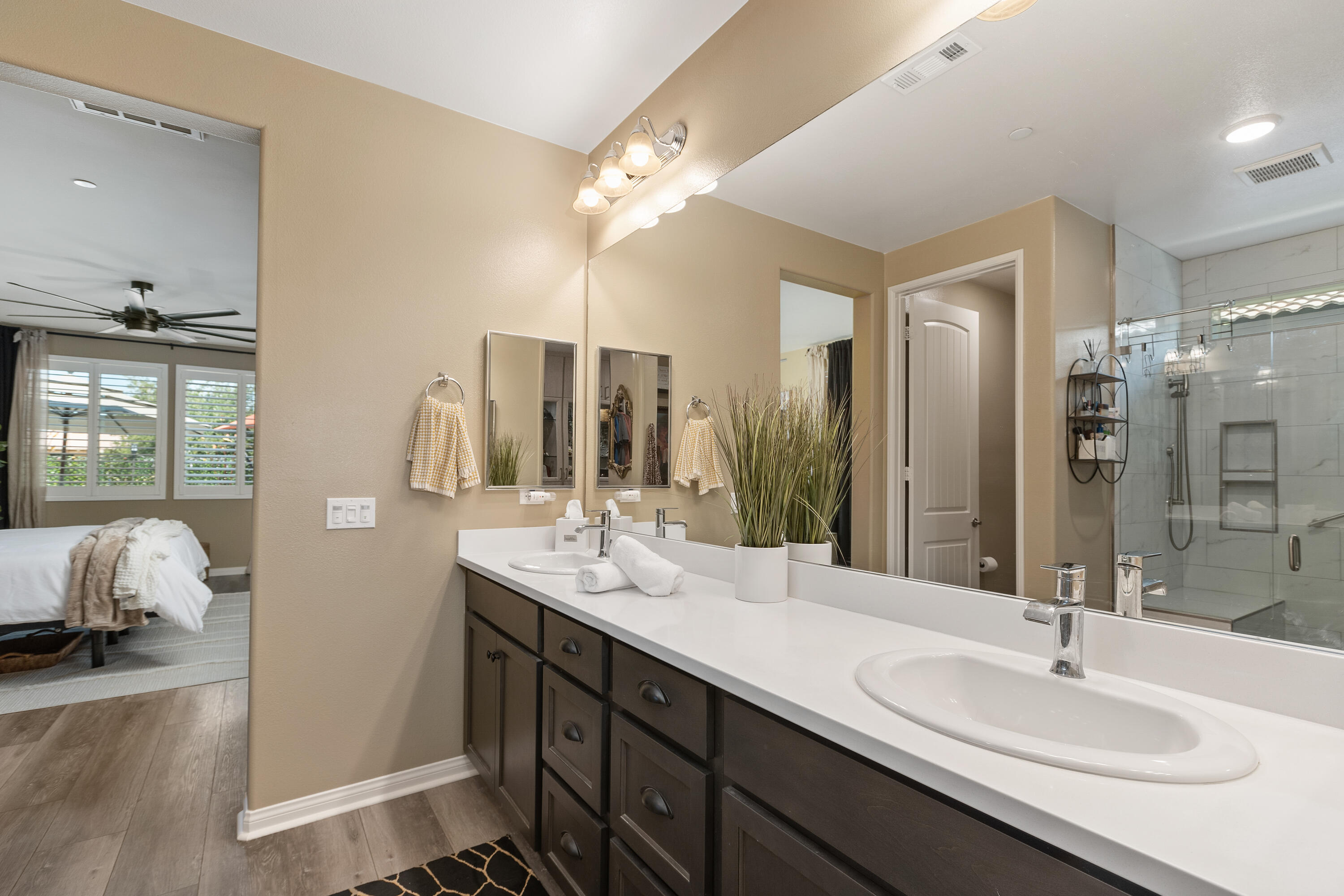 82700 Burnette Drive Indio, CA 92201 - Photo 16 of 38 a bathroom with double vanity sinks and a mirror