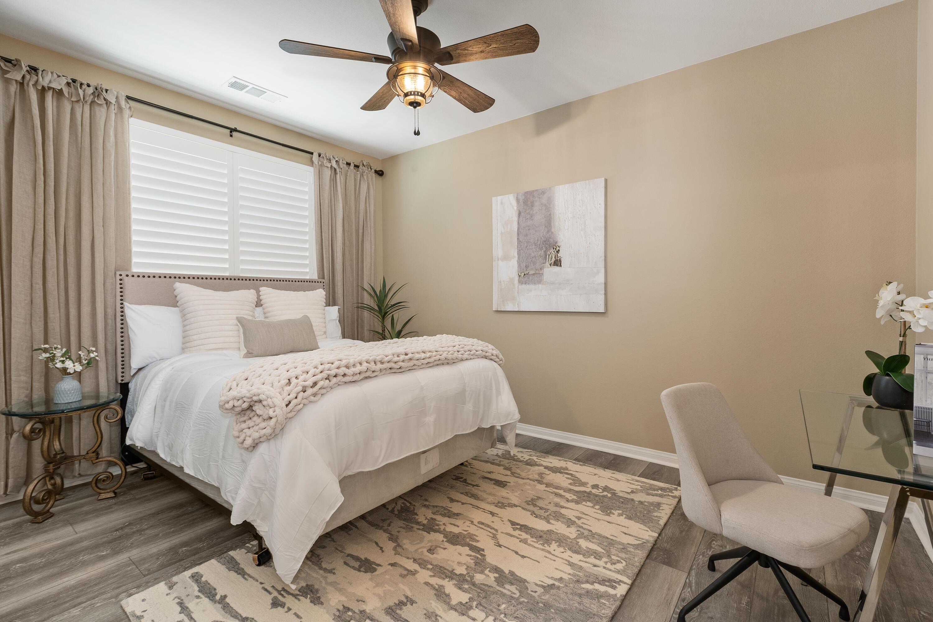 82700 Burnette Drive Indio, CA 92201 - Photo 17 of 38 a bedroom with a bed a chair and a dresser