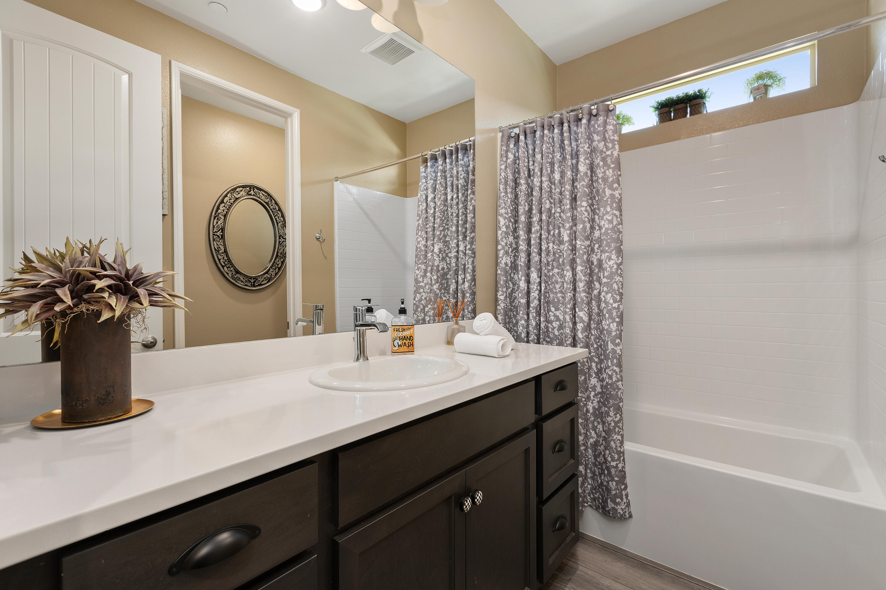 82700 Burnette Drive Indio, CA 92201 - Photo 20 of 38 a bathroom with a granite countertop sink and a mirror