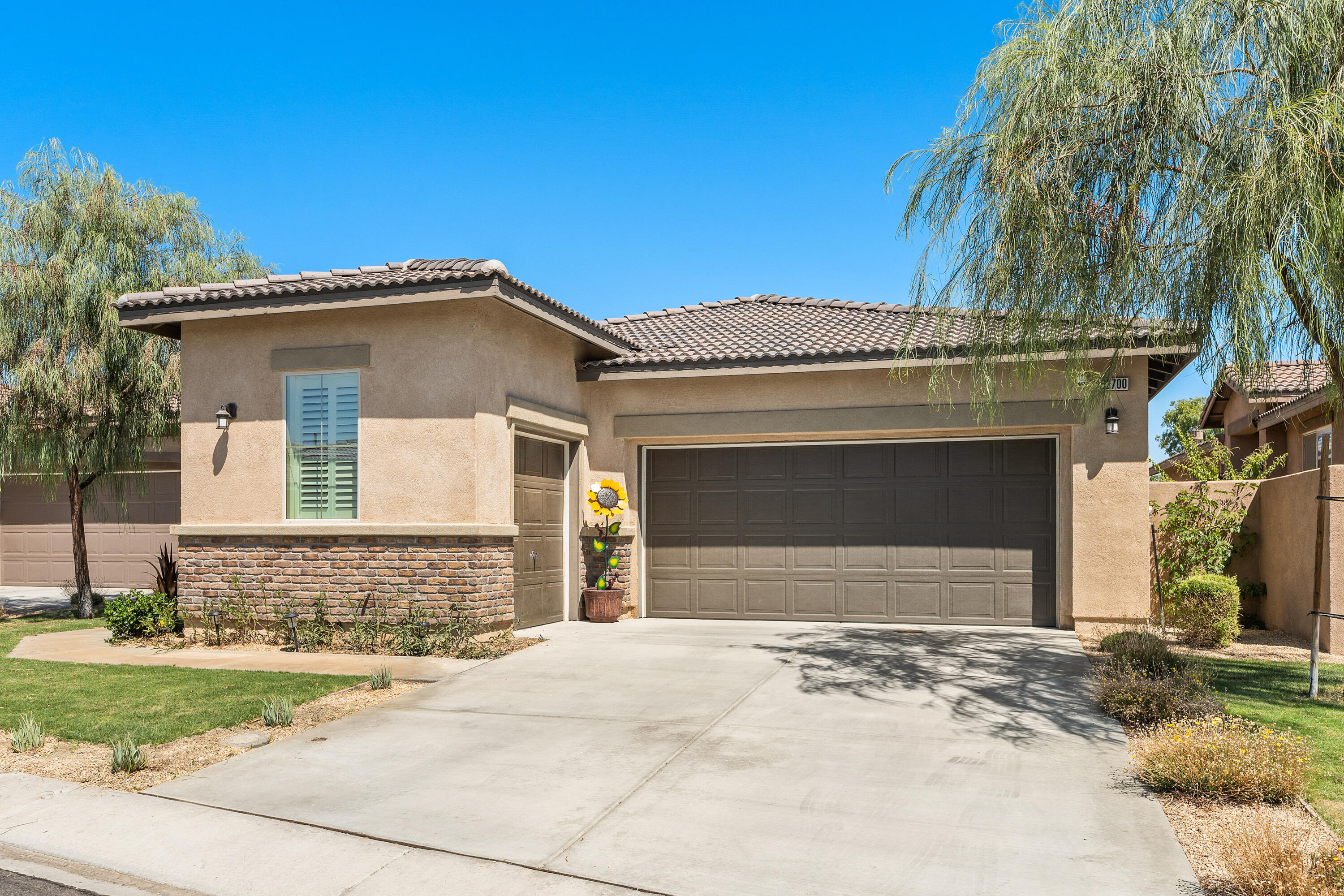 82700 Burnette Drive Indio, CA 92201 - Photo 32 of 38 a front view of a house