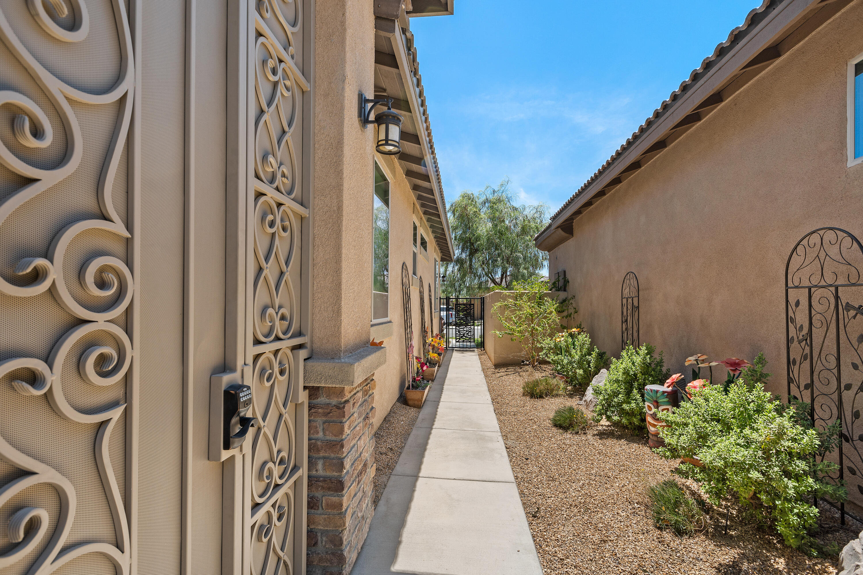82700 Burnette Drive Indio, CA 92201 - Photo 38 of 38 a view of a pathway house with potted plants
