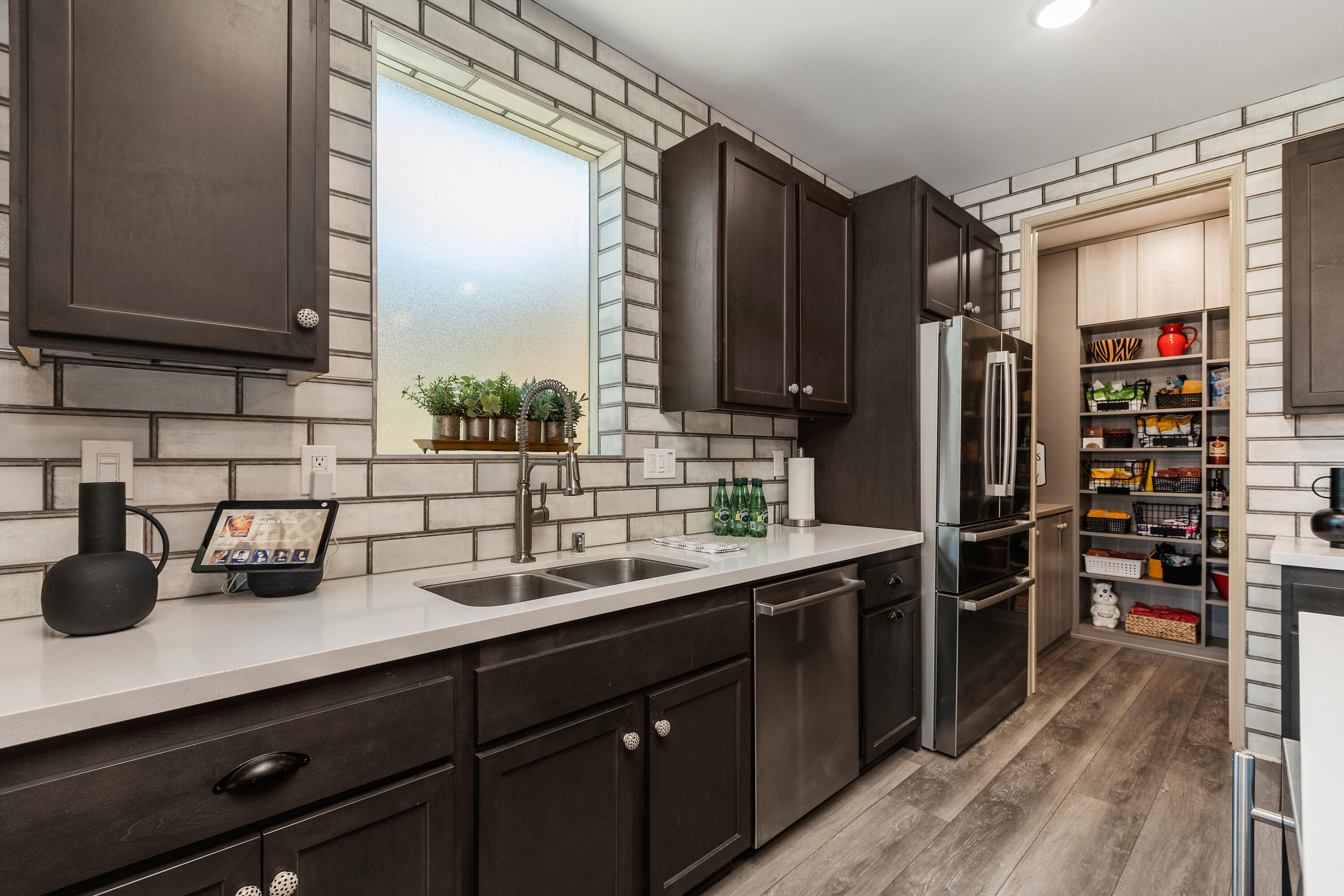 82700 Burnette Drive Indio, CA 92201 - Photo 8 of 38 a kitchen with stainless steel appliances a sink dishwasher stove and refrigerator