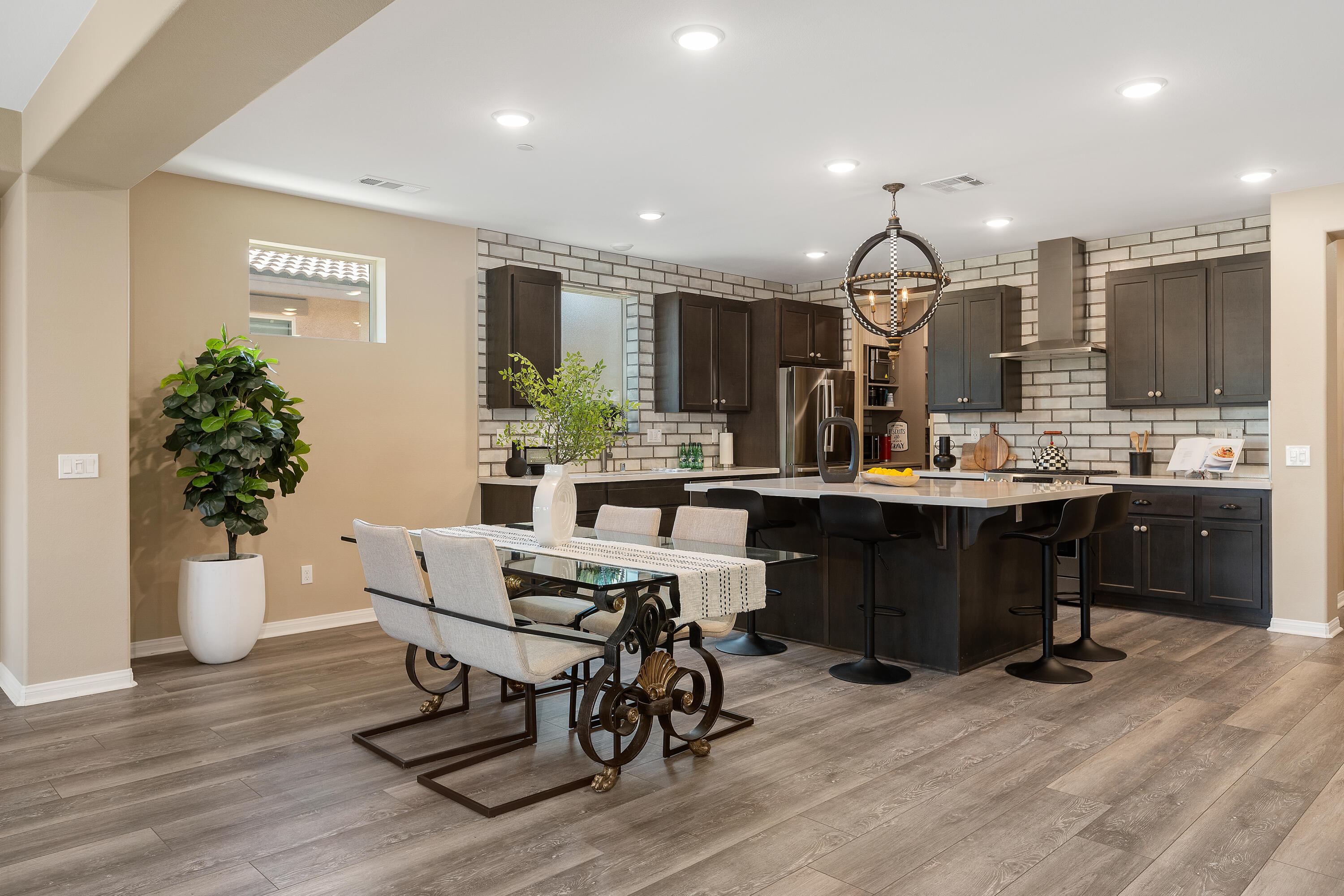82700 Burnette Drive Indio, CA 92201 - Photo 9 of 38 a kitchen with a table and chairs in it