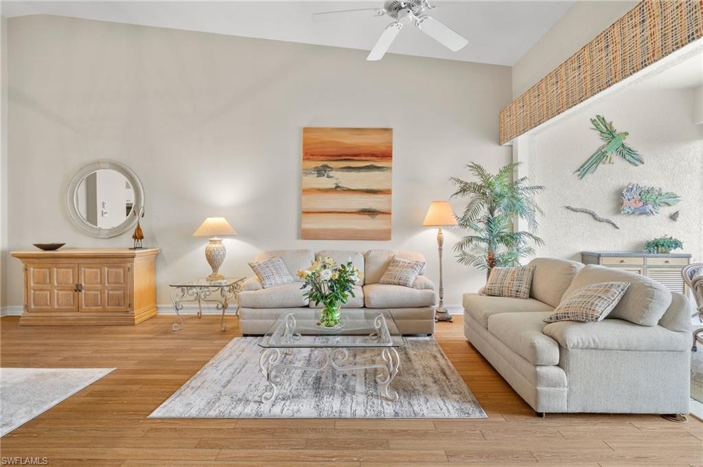 a living room with furniture flowerpot and window