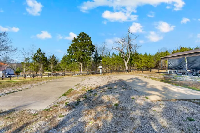 a view of a house with a yard and balcony
