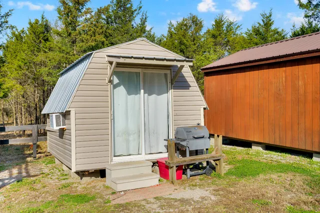 a backyard of a house with a garden and plants