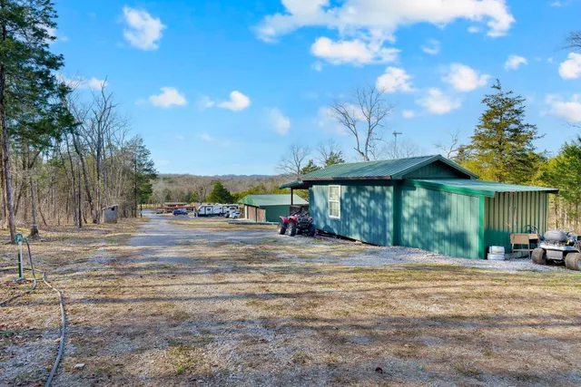 a backyard of apartments with large trees
