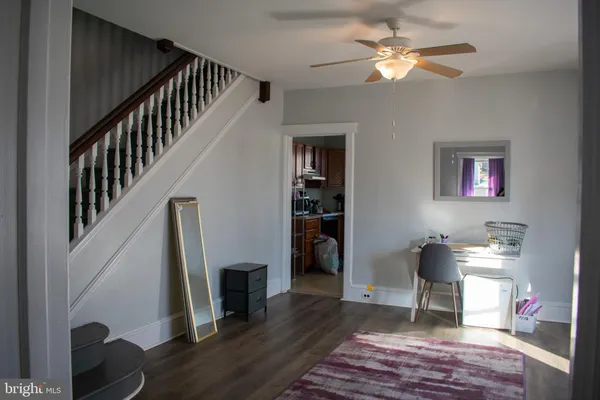 a view of entryway with livingroom and wooden floor