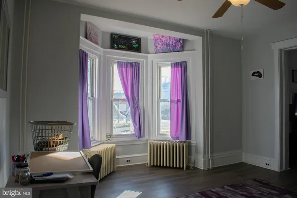 a living room with furniture and windows