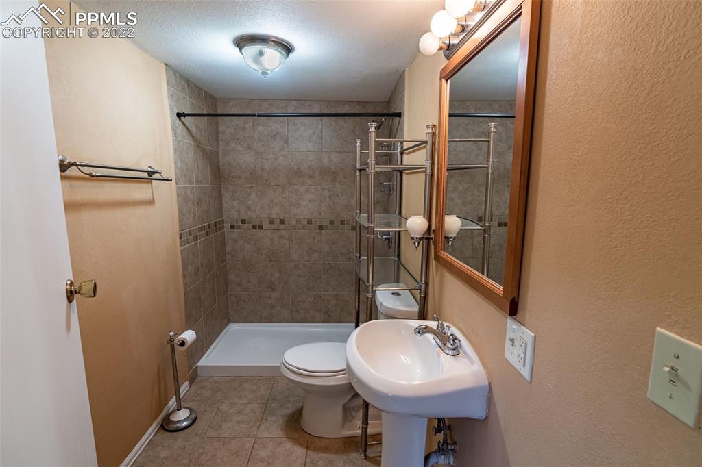 918 B Street Penrose, CO 81240 - Photo 12 of 23 a bathroom with a sink toilet and shower