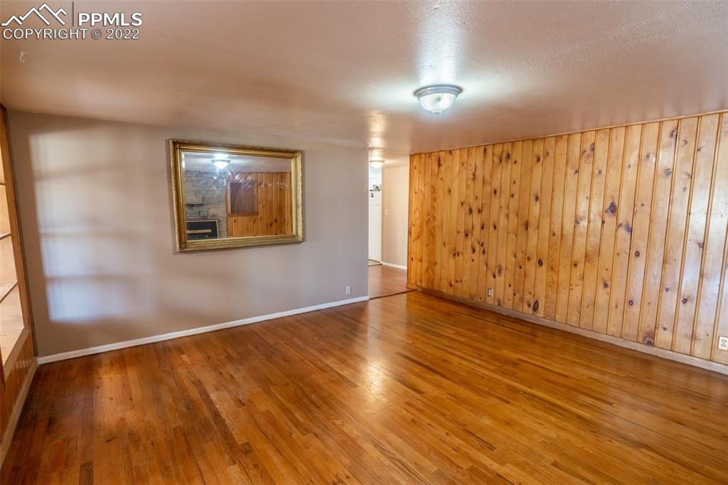 918 B Street Penrose, CO 81240 - Photo 13 of 23 a view of an empty room with wooden floor and a window