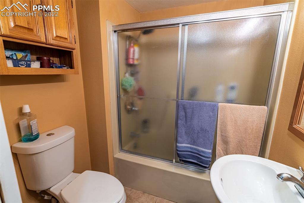 918 B Street Penrose, CO 81240 - Photo 18 of 23 a bathroom with a toilet and a shower