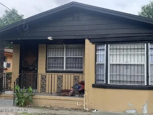 a front view of a house with a porch