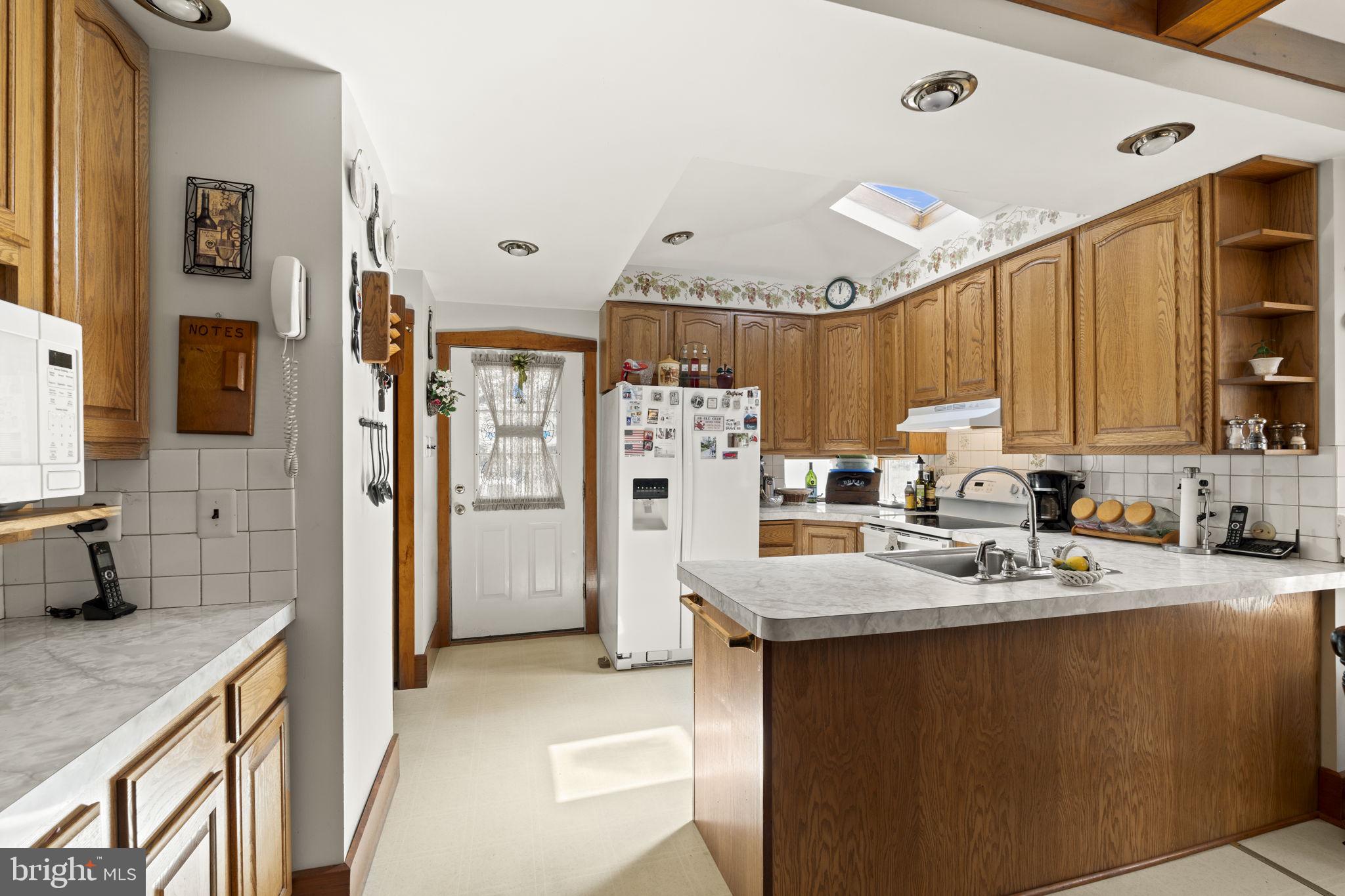 186 South Rte 73 Hammonton, NJ 08037 - Photo 14 of 38 a kitchen with refrigerator and cabinets