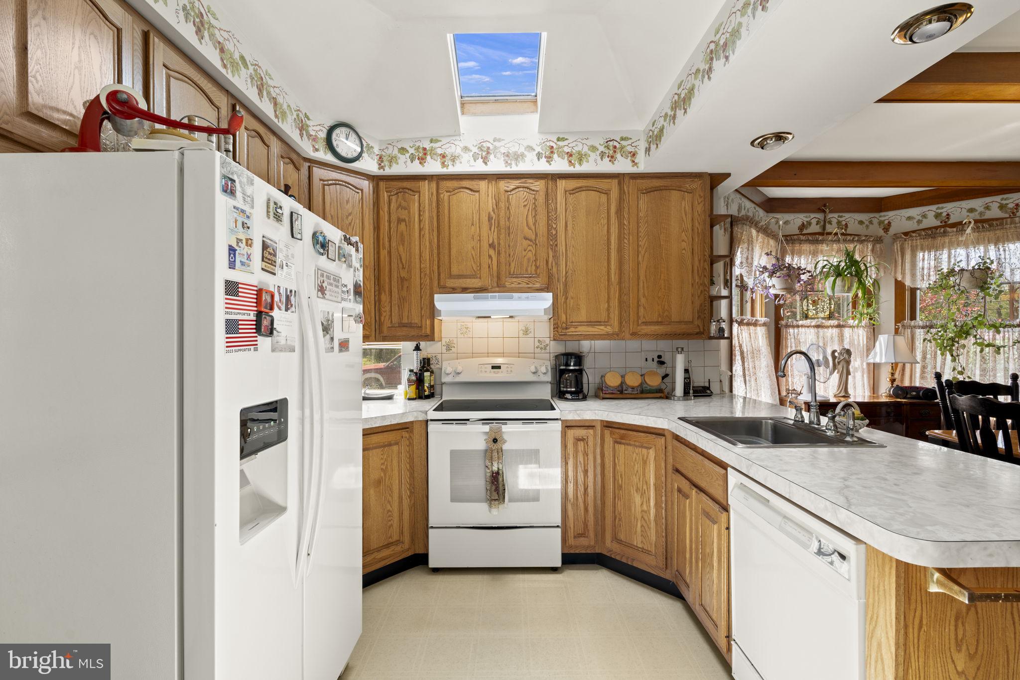 186 South Rte 73 Hammonton, NJ 08037 - Photo 15 of 38 a kitchen with a sink stove and refrigerator
