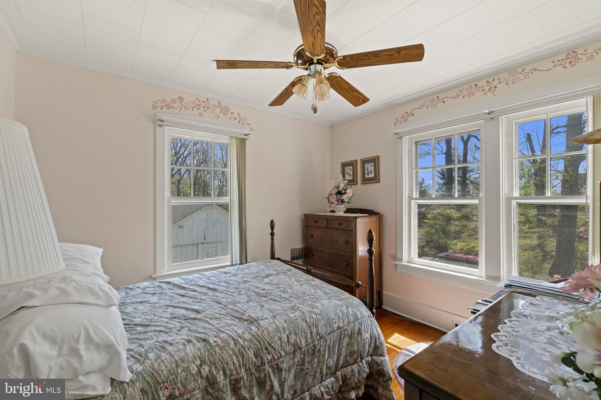 186 South Rte 73 Hammonton, NJ 08037 - Photo 18 of 38 a bedroom with a bed and wooden floor