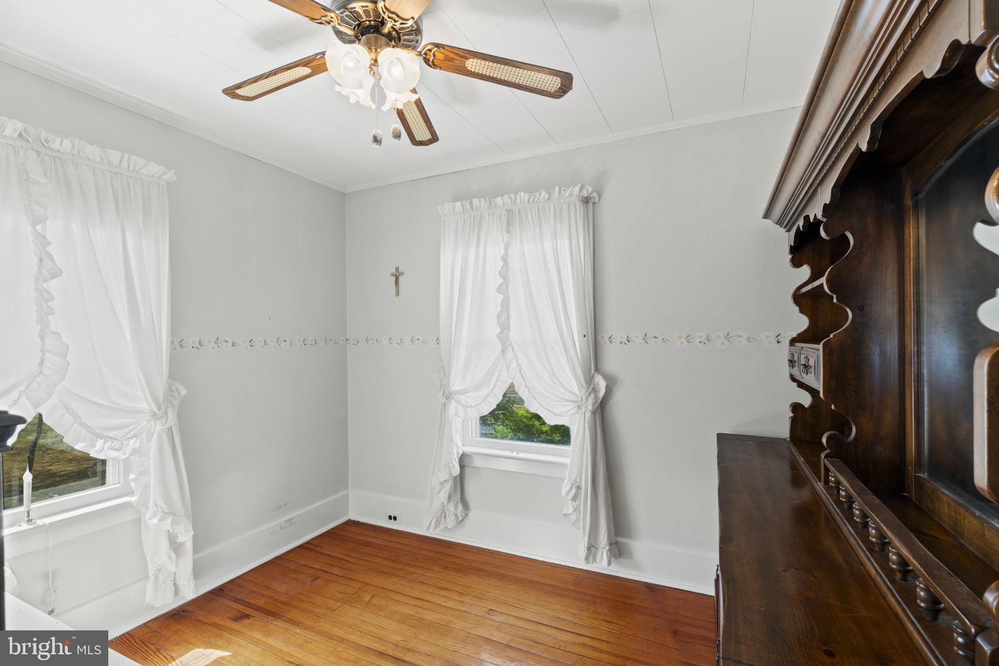 186 South Rte 73 Hammonton, NJ 08037 - Photo 19 of 38 a view of an empty room with wooden floor and a window