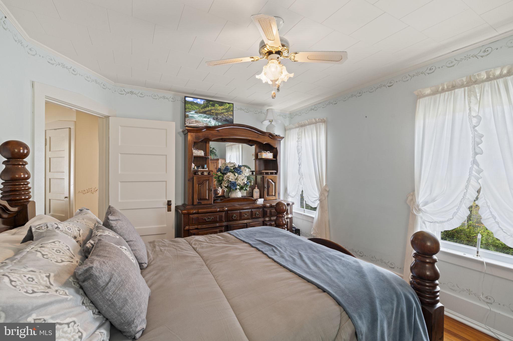 186 South Rte 73 Hammonton, NJ 08037 - Photo 22 of 38 a bedroom with a bed and a chandelier