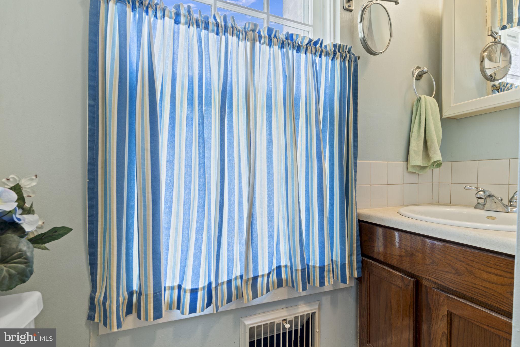 186 South Rte 73 Hammonton, NJ 08037 - Photo 24 of 38 a bathroom with a sink and a mirror